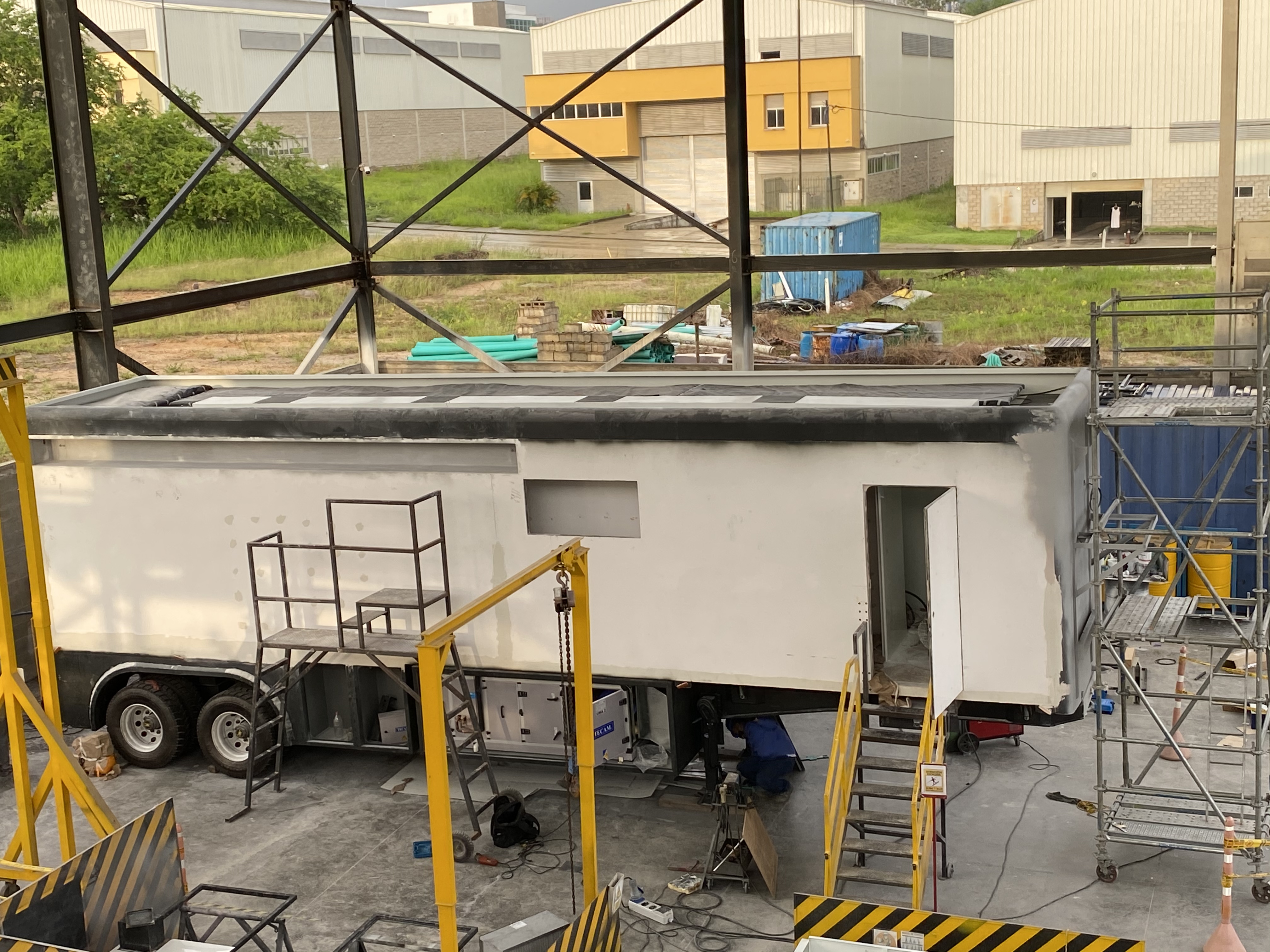 Aerial view of the laboratory body during fabrication at NINOX's Cali facility, November 2020. The aluminum sandwich structure with high-density thermal insulation core is visible in the assembly stage.