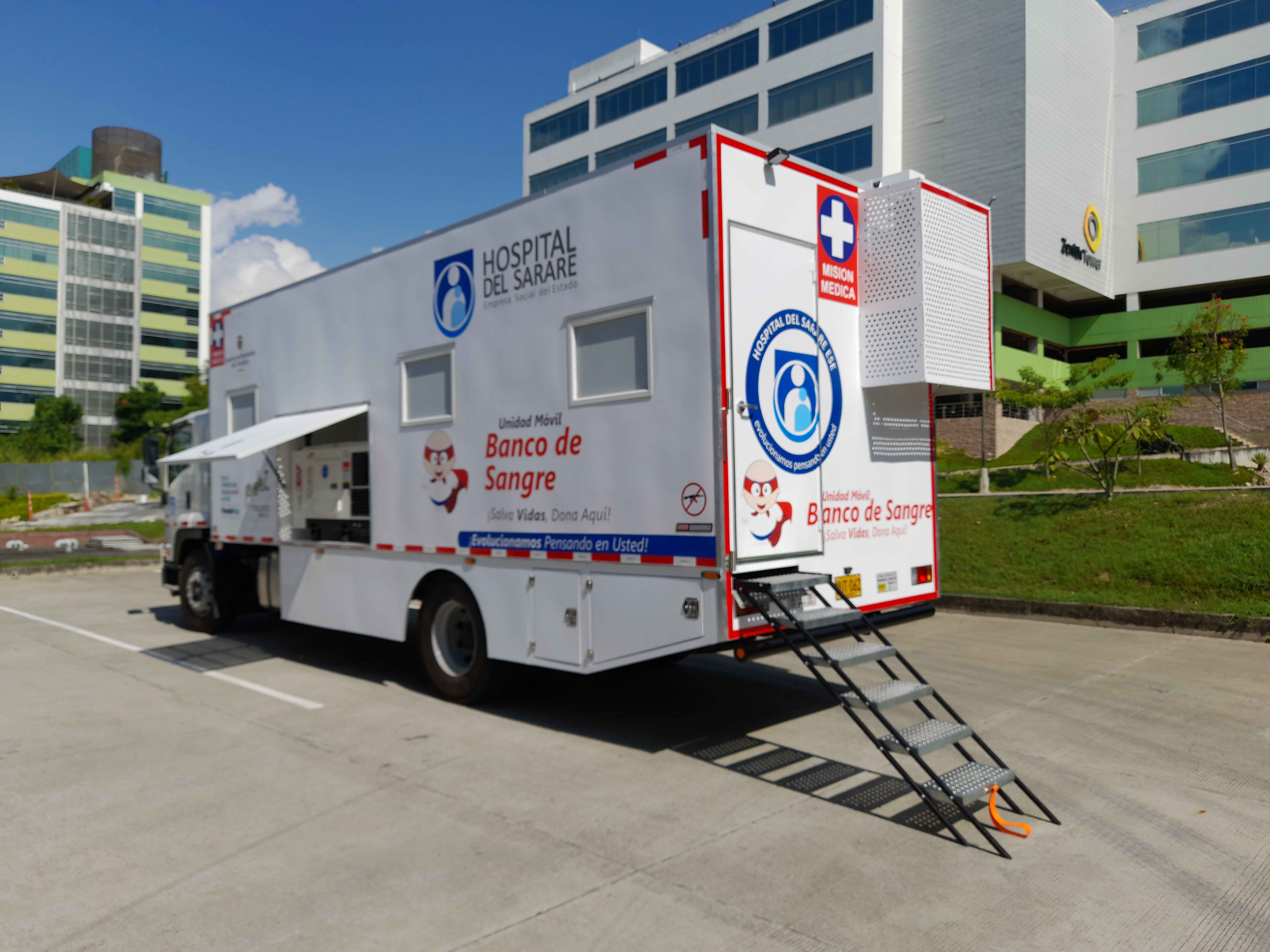 Mobile Blood Bank unit with access ramp deployed and side awning extended, ready to operate in the field.