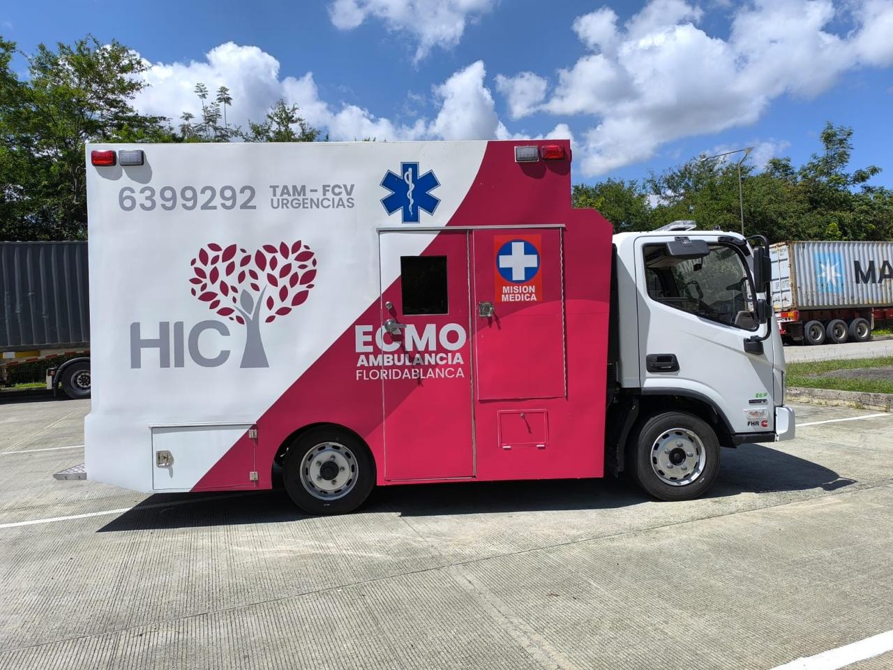 Lateral view: the HIC ECMO Ambulance in its distinctive institutional crimson