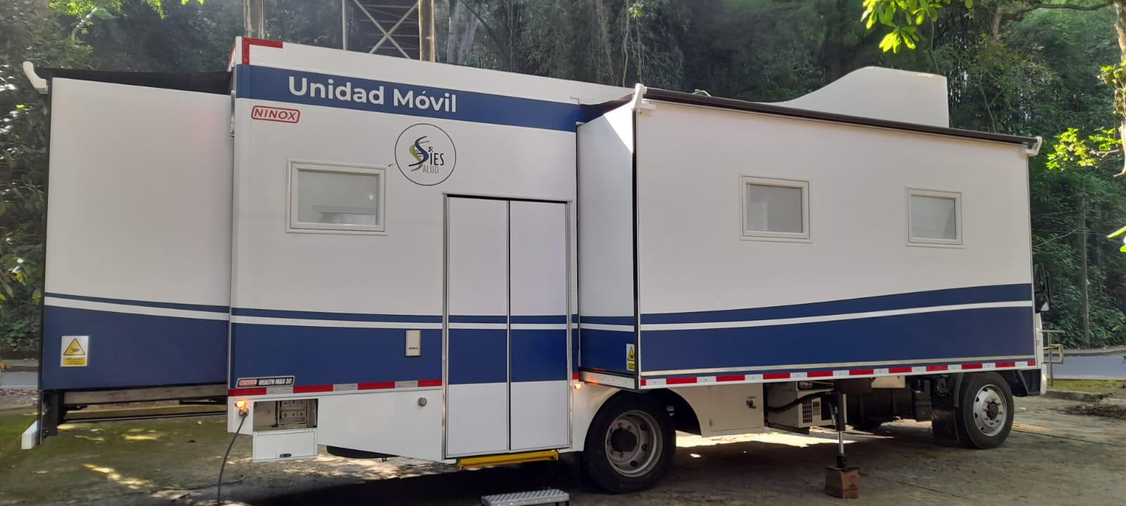 Rear-lateral view of the unit with the expansion module fully deployed, revealing the scale of operational space available in the field.